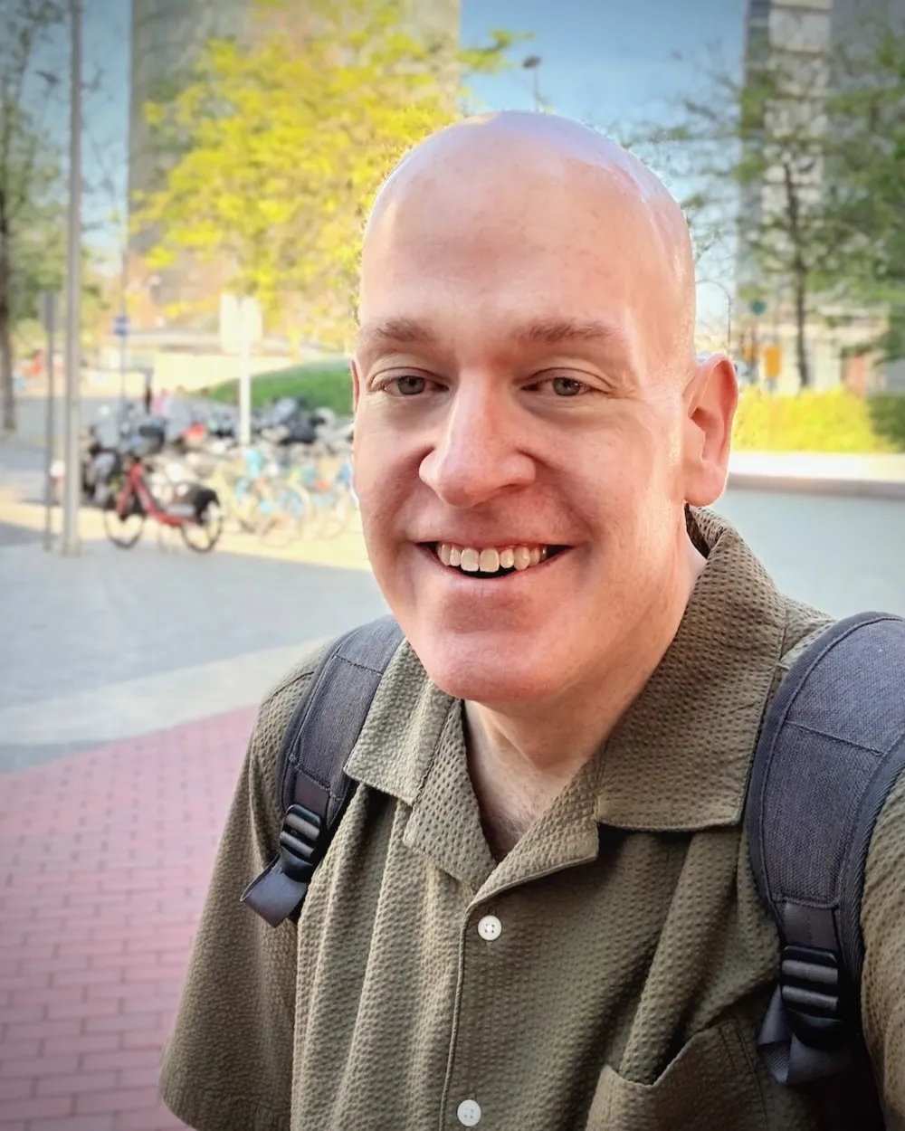 Jensen Harris, smiling outdoors on a city street